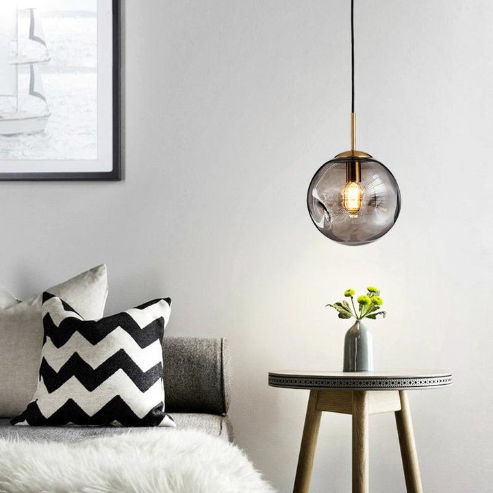 Lampe suspendue à boule en verre de Brikey